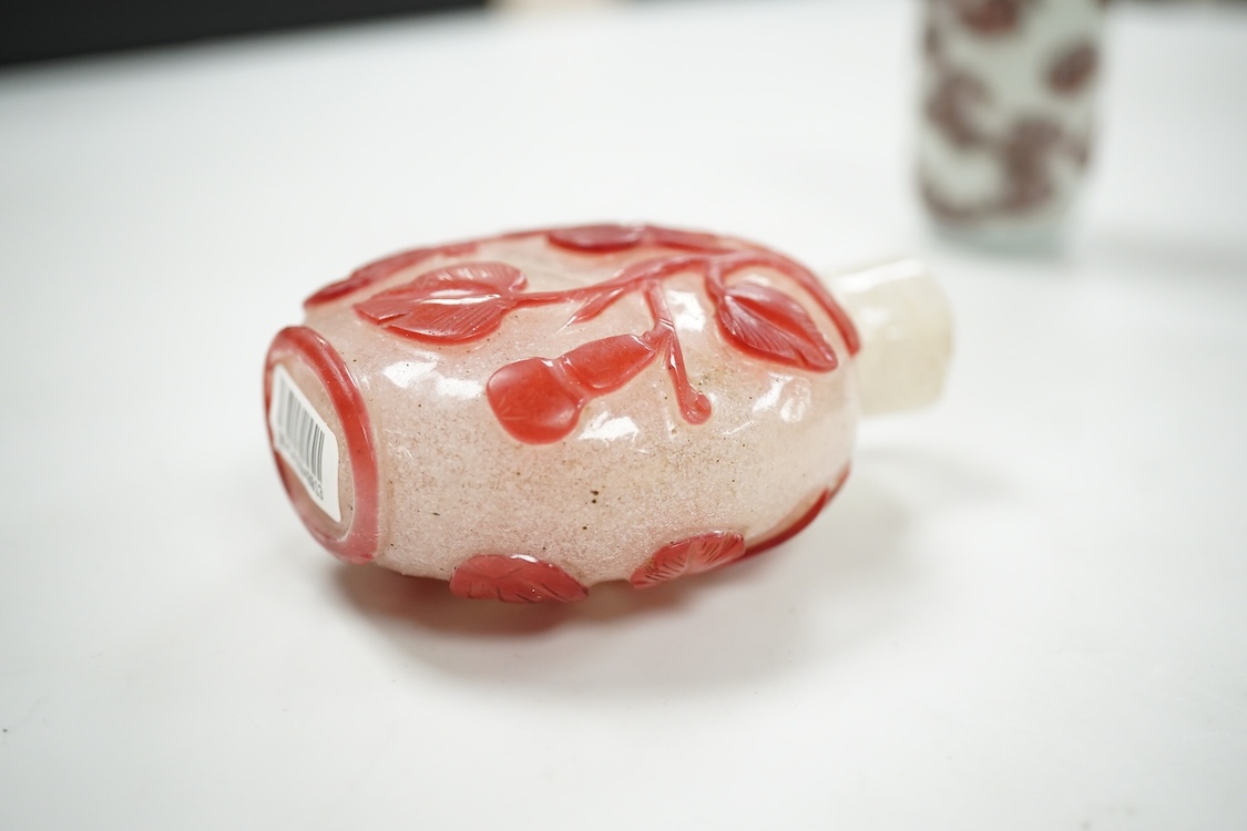 A Chinese cinnabar lacquer snuff bottle, a glass overlay snuff bottle and an underglaze copper red snuff bottle-9cm high (3)